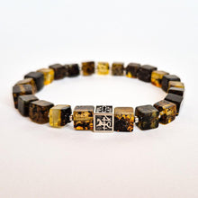 Load image into Gallery viewer, A bracelet featuring polished Baltic amber beads and a handcrafted silver charm with the 'Vytis' symbol.