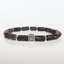 Load image into Gallery viewer, Bracelet with brown Baltic amber beads and a silver Vytis on a white background