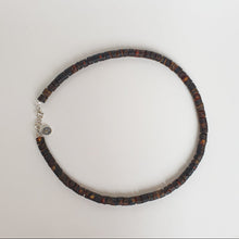 Load image into Gallery viewer, Amber necklace for men with a silver clasp on a light gray background