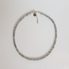 Load image into Gallery viewer, Necklace with small beads on a light gray background